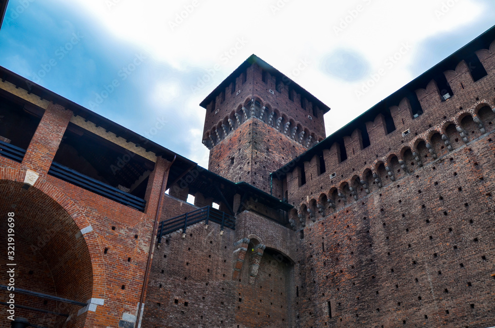 Tower and brick walls of old medieval Sforza Castle (Castello Sforzesco) Milan, Lombardy, Italy