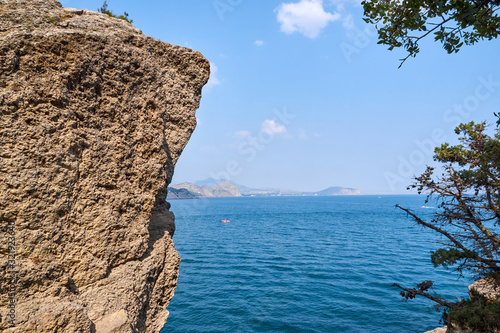 Obraz na płótnie View of Green Bay, coastal cliffs and a ridge of mountains on the horizon. Black Sea coast, Sudak region, Republic of Crimea w salonie