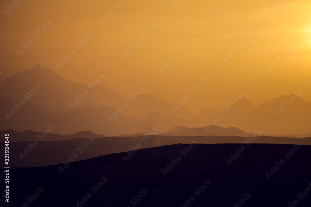A view of mountains and sunset in the desert of Egypt