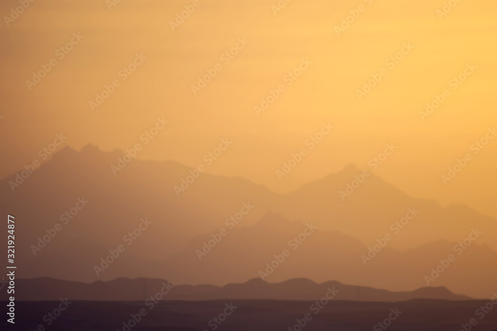 A view of mountains and sunset in the desert of Egypt