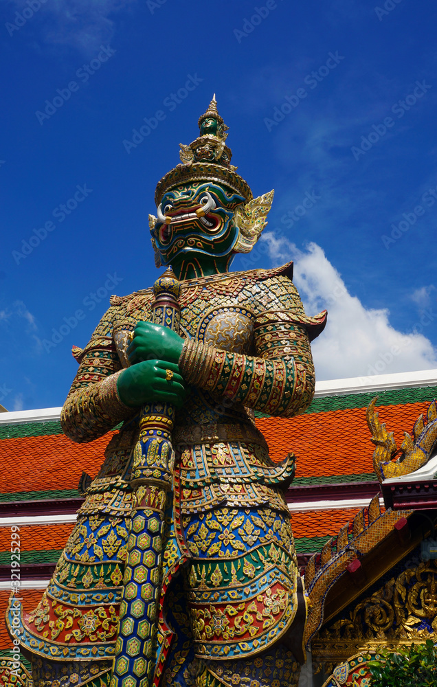 Ornately carved figure guarding Bangkok's Grand Palace