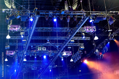 Stage construction with trusses, loudspeakers and stage lighting photo