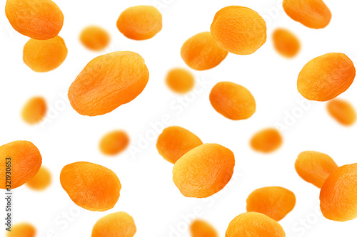 Falling Dried apricot isolated on white background, selective focus
