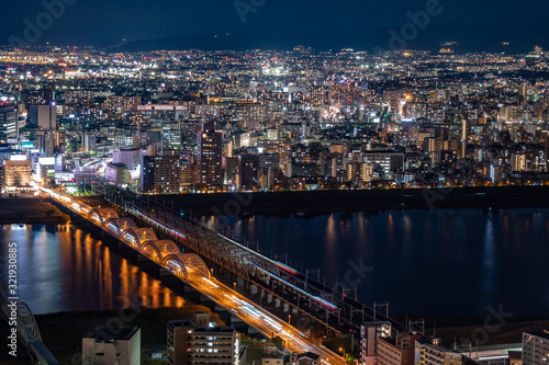 Japan. Osaka. Evening panorama of the big city. Bridges over the Yodo river. A huge city in the dark time. The lights of the big city. Guide to Japan. Japanese landscapes. Urbanistics.