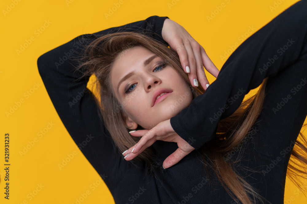 Young woman smiling on yellow background. Portrait of happy girl smiling in studio. Close up of fashion model smile. Happy woman in yellow sunglasses looking in camera Young woman smiling on yellow background. Portrait of happy girl smiling in studio. Close up of fashion model smile. Happy woman in yellow sunglasses looking in camera