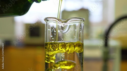Two immiscible liquids in a graduated cylinder showing a difference in density. 