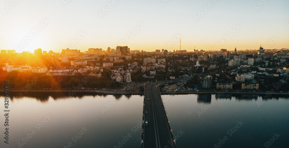 Voronezh panorama at sunset from above, aerial view of Chernavsky bridge over Voronezh River and right bank, toned Voronezh panorama at sunset from above, aerial view of Chernavsky bridge over Voronezh River and right bank, toned
