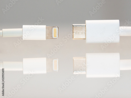 Lightning vs USB-C . The European Union is pushing Apple and other cellphone manufacturers into adopting USB C as the standard charging and data connector.