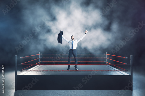 Winner businessman standing on boxing ring © Who is Danny