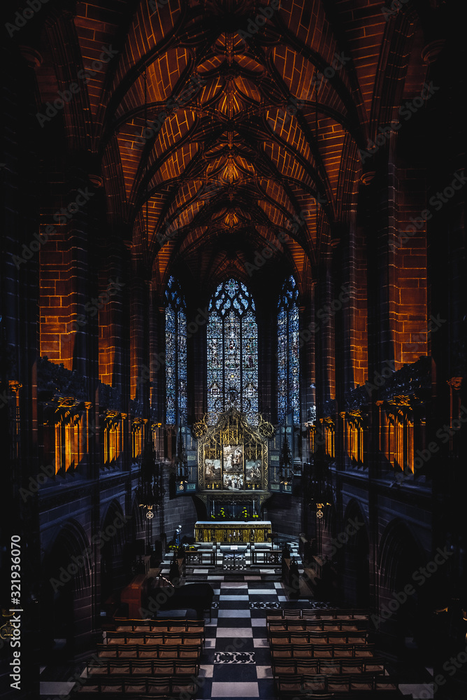 LIVERPOOL, ENGLAND, DECEMBER 27, 2018: The Lady Chapel in Liverpool Anglican Cathedral. Perspective view of a magnificent part inside the church, where light meets darkness all along place.