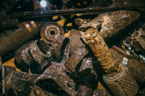 Old rusty shells, grenades and bullets of World War 2, close up. Vintage military equipment.