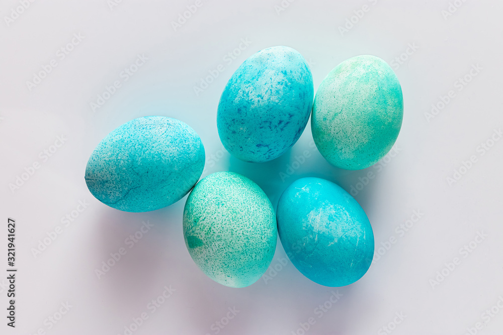 Beautiful blue easter eggs on a light background. Beautiful blue easter eggs on a light background.