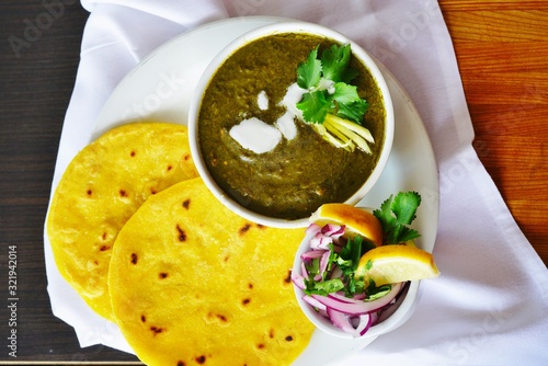 A dish of sarson ka saag spinach stew at an Indian restaurant photo