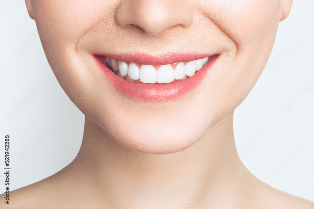 Obraz premium Perfect healthy teeth smile of a young woman. Teeth whitening. Dental clinic patient. Image symbolizes oral care dentistry, stomatology. Dentistry image.