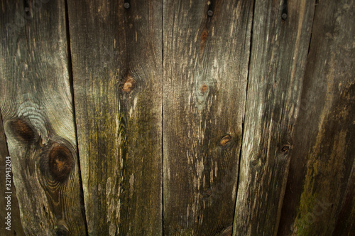 old gray wooden wall with knots