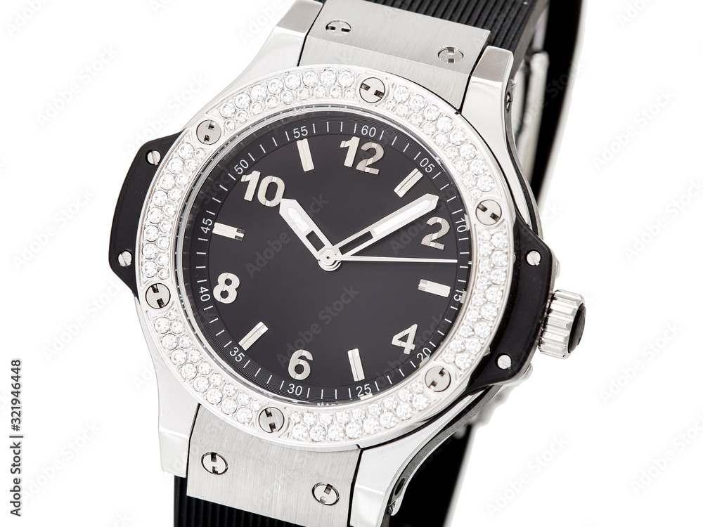 wristwatch decorated with rhinestones made of precious stones on a silver case with a black dial and a black rubber strap, close up female wristwatch isolated on white background. wristwatch decorated with rhinestones made of precious stones on a silver case with a black dial and a black rubber strap, close up female wristwatch isolated on white background.