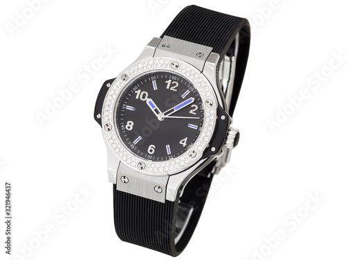 watches decorated with rhinestones made of precious stones on a silver case with a black dial and a arrows with blue insert black, close up female wristwatch isolated on white.