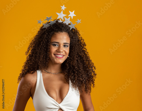 Beautiful woman dressed for carnival night. Smiling woman ready to enjoy the carnival.