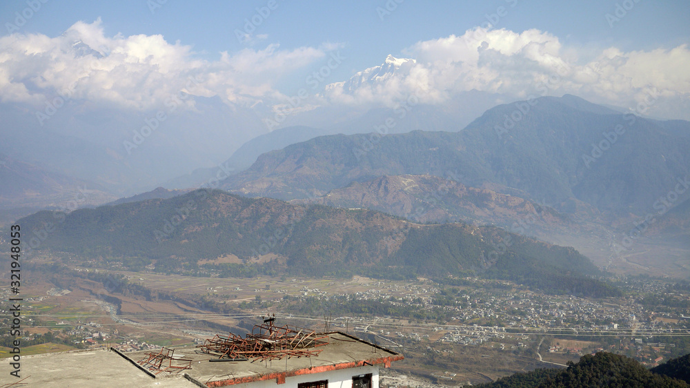 the town of pokhara surround by the snow mountain in the valley natural background the town of pokhara surround by the snow mountain in the valley natural background