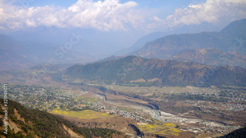 the town of pokhara surround by the snow mountain in the valley natural background