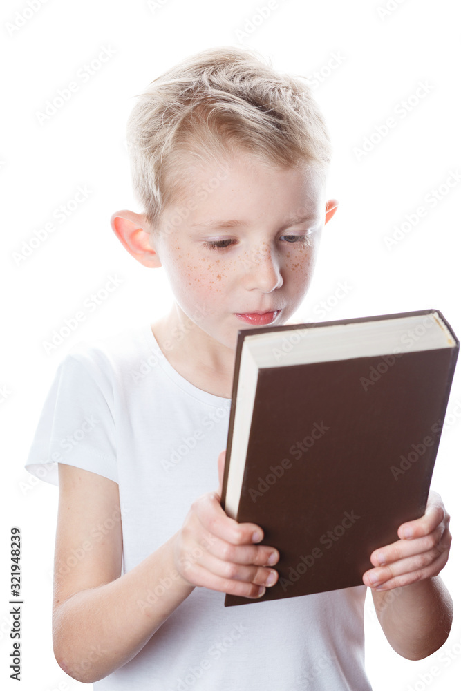 small boy looks at closed book, portrait small boy looks at closed book, portrait