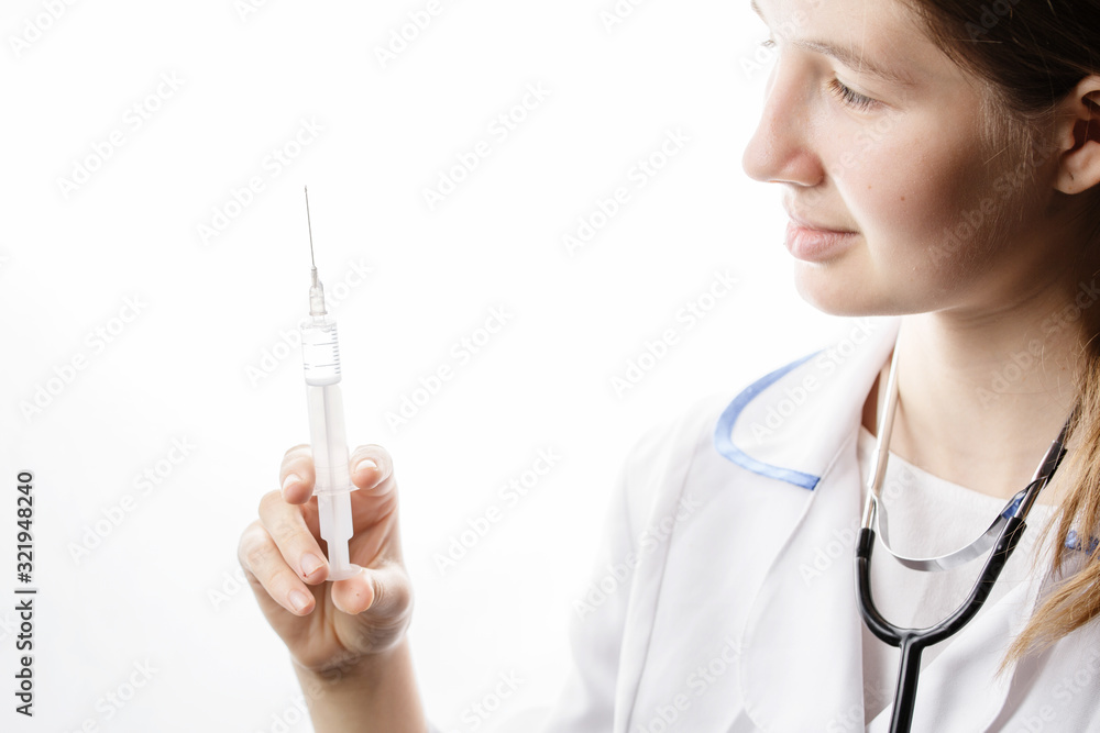 doctor in white lab coat with syringe in hands doctor in white lab coat with syringe in hands