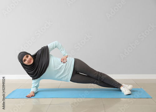 Sporty Muslim woman practic...