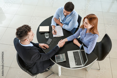 Bank manager and clients sh...