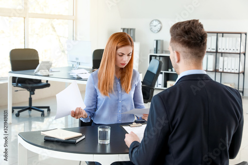 Bank manager working with d...