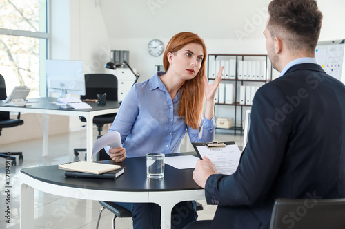 Bank manager working with d...