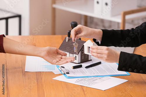 Real estate agent giving a ...