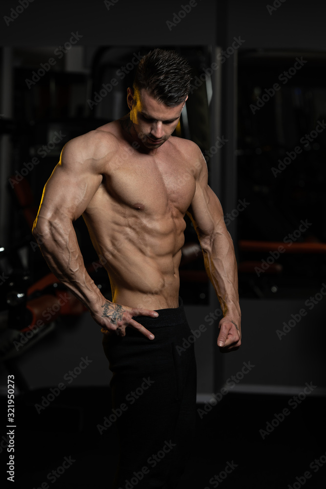 Muscular Bodybuilder Flexing Muscles