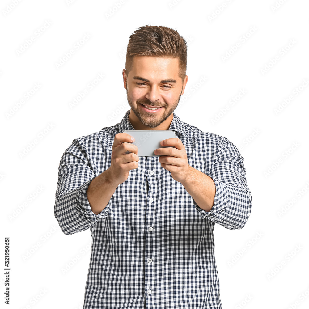 Young man with mobile phone on white background Young man with mobile phone on white background