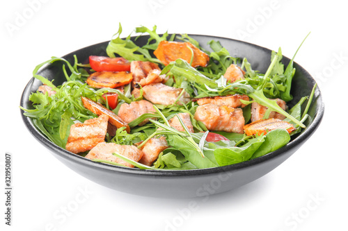 Plate with tasty salmon salad on white background