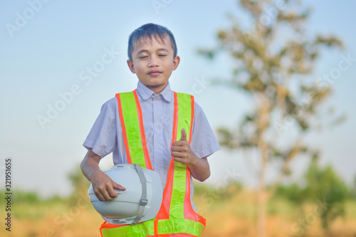 Boy With Helmet hardhat safety Engineer concept © Suriyo