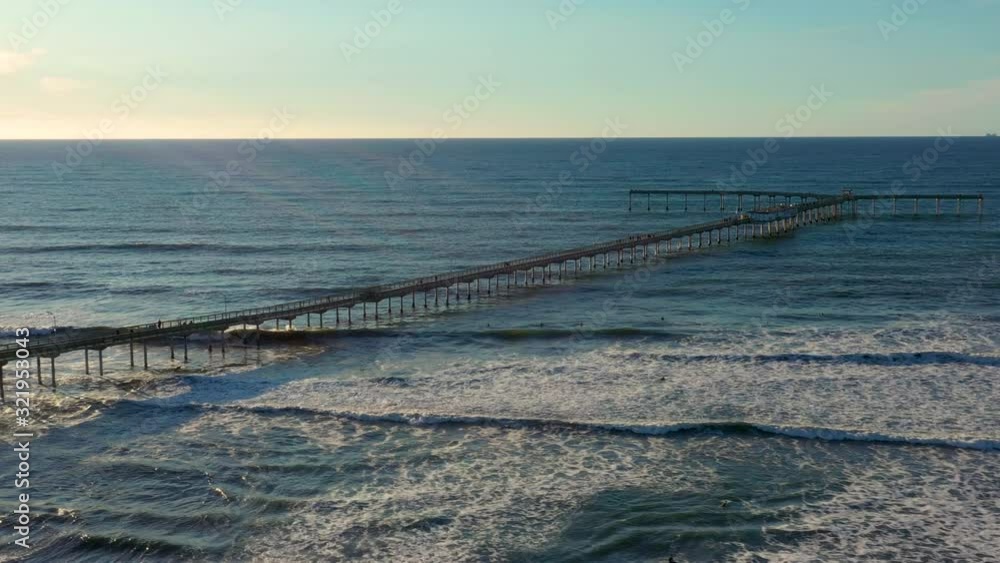 Beautiful 4k aerial flight over a large pier jetting into the ocean Beautiful 4k aerial flight over a large pier jetting into the ocean