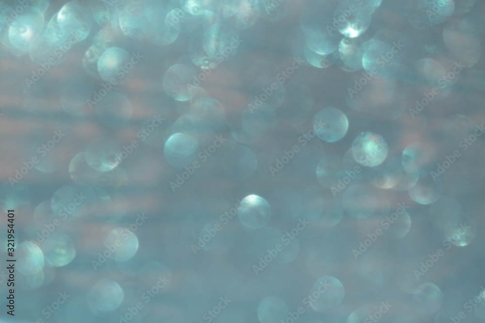 Bokeh of bright glittering sheets that reflect sunlight. Bokeh of bright glittering sheets that reflect sunlight.
