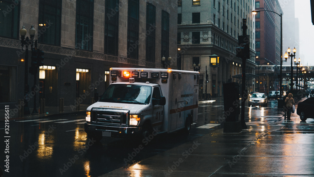 ambulance on a rainy day in a big city