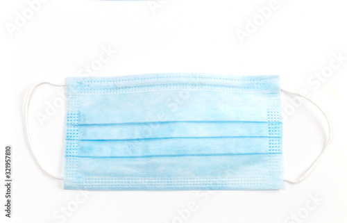 A close-up shot of a disposable surgical mask