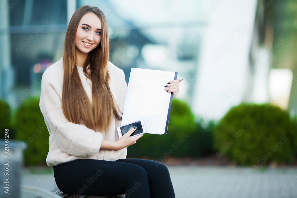 Business woman with document near business centre Business woman with document near business centre