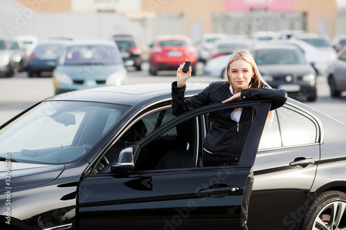 Young happy woman bought new modern car. © Maksymiv Iurii
