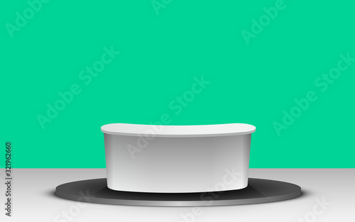 white table with green background in the news studio room	