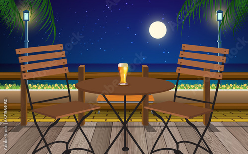 table and chair in cafe on the beach in the night	