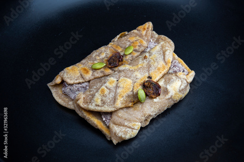 Fried Sorghum pancake with red bean which is called susu bukkumi in Korea photo