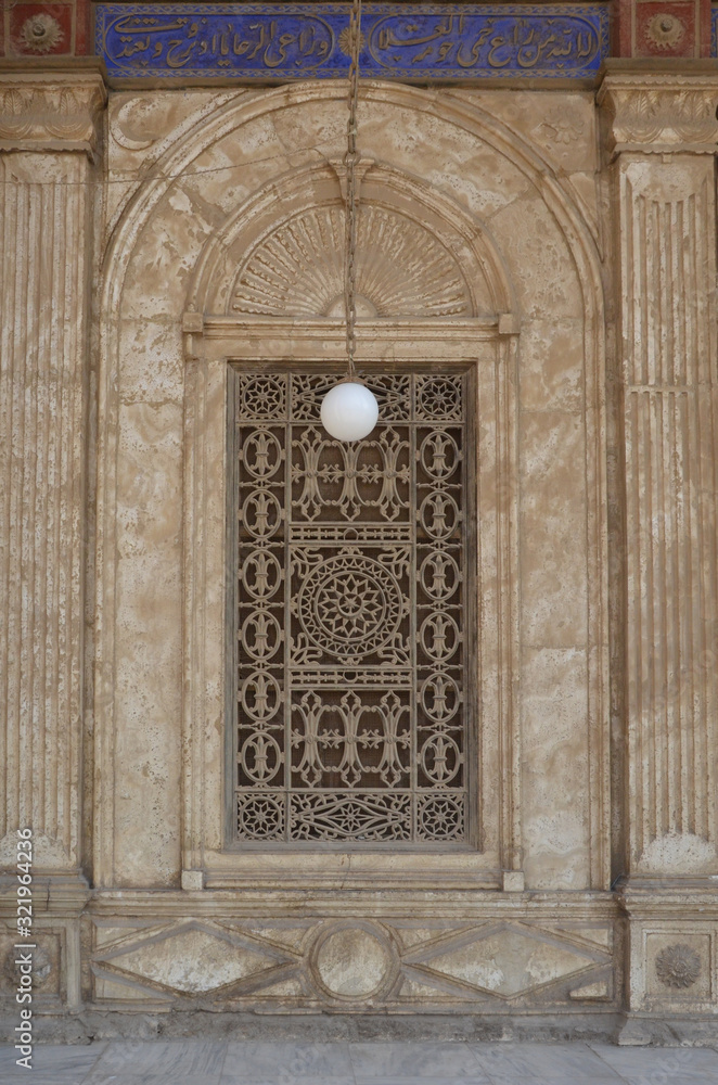 Architectural details of arcade gallery of The Great Mosque of Muhammad Ali Pasha (Alabaster Mosque) in the Citadel of Cairo in Egypt. Beautiful carving and intrigue exterior.