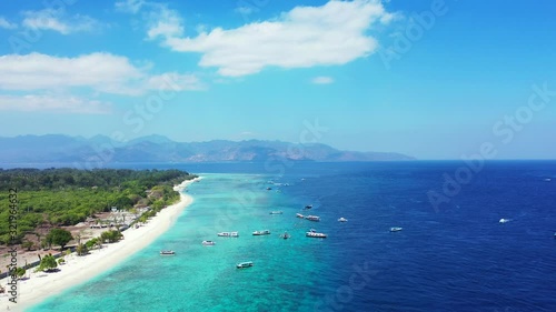 Wallpaper Mural Stunningly beautiful exotic beach with clear blue skies, water and boats with trees scattered down the shoreline in the tropical holiday location of Hawaii Torontodigital.ca