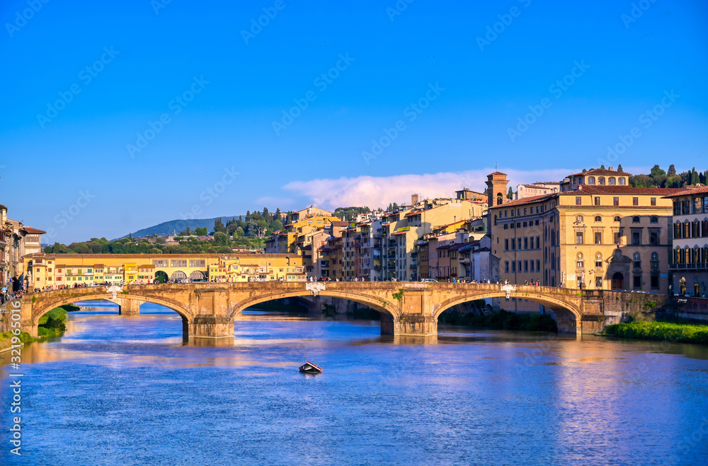 A view of the Arno River towards the Ponte Vecchio in Florence, Italy.