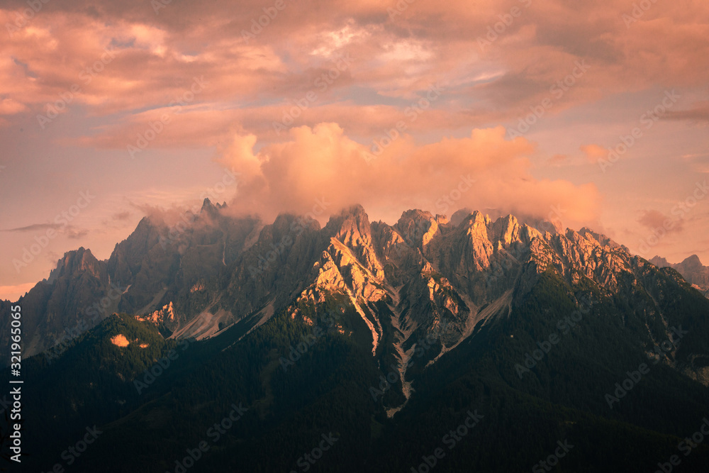 Mountains under sunset light, as seen from Cinque Torri, Dolomite Alps, Italy