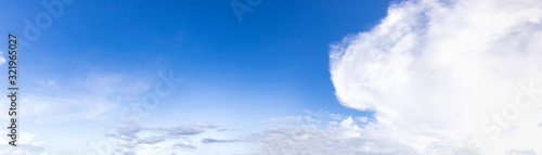 Panoramic white fluffy clouds agent blue sky