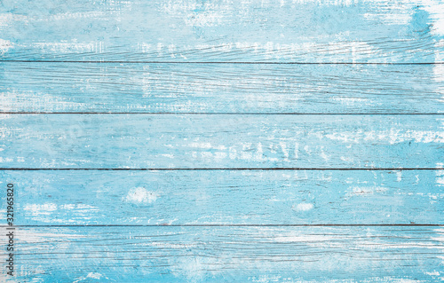 Vintage beach wood background - Old weathered wooden plank painted in turquoise or blue sea color.